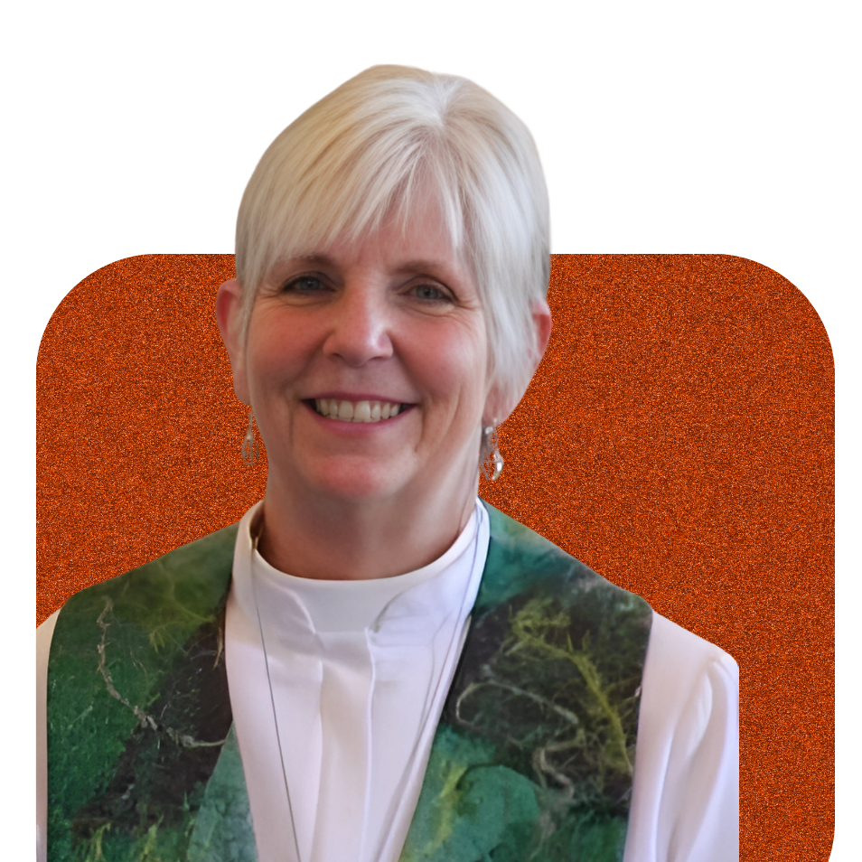 Smiling woman in a white blouse and green vest against an orange background