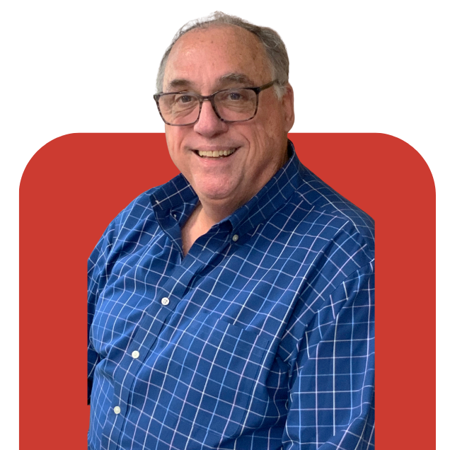 Smiling man in glasses wearing a blue checkered shirt on a red background