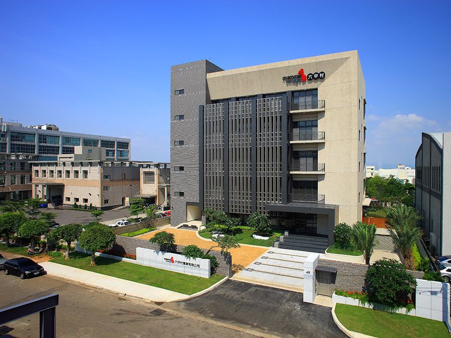 A large building with a red logo on the top of it
