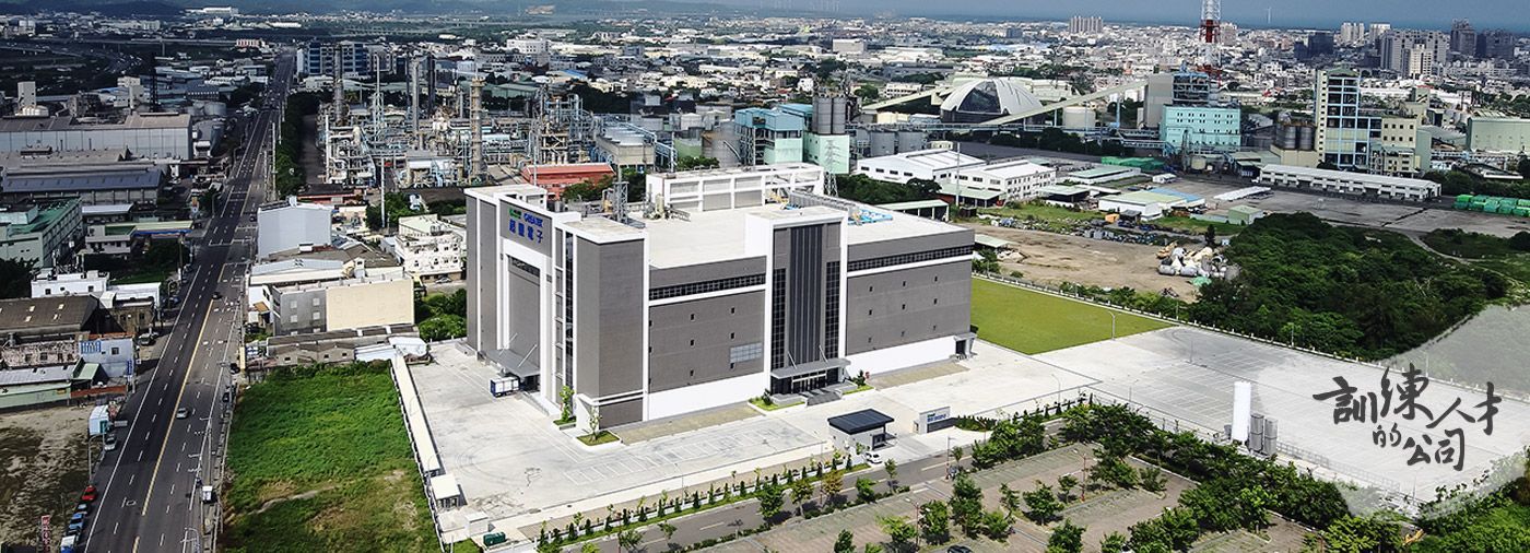 An aerial view of a large building in the middle of a city.