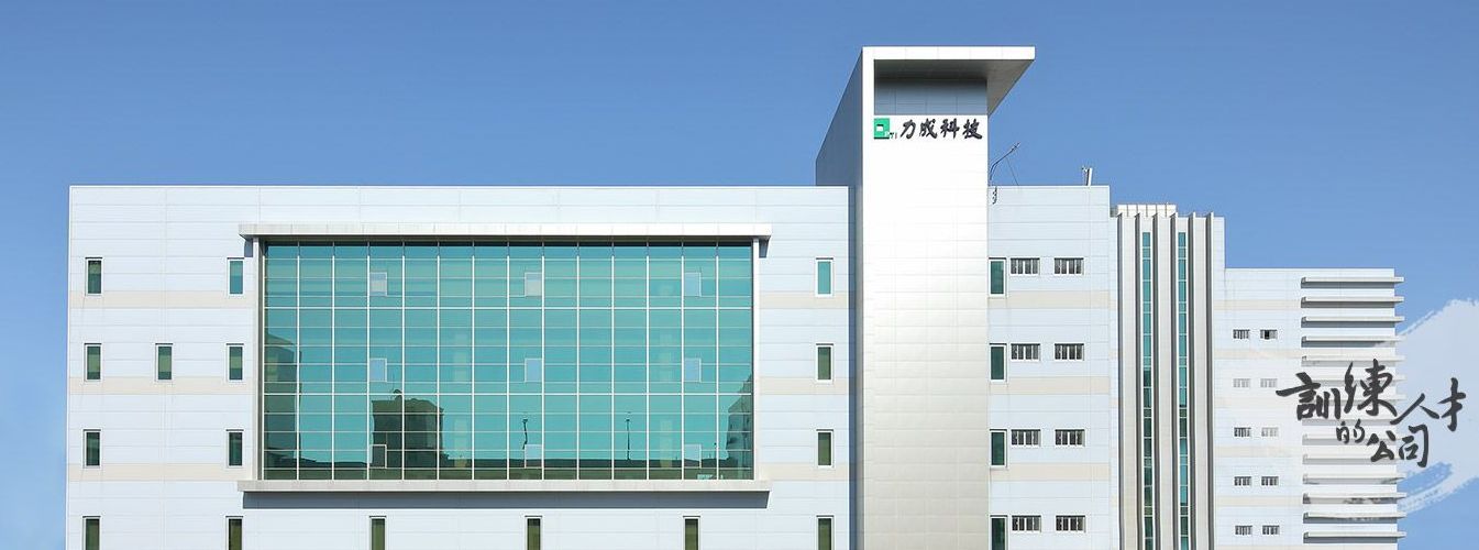 A large white building with a blue sky in the background