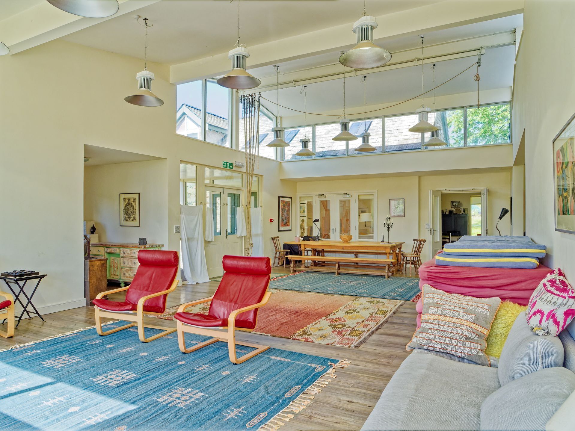 A living room with a sofa and chairs in it
