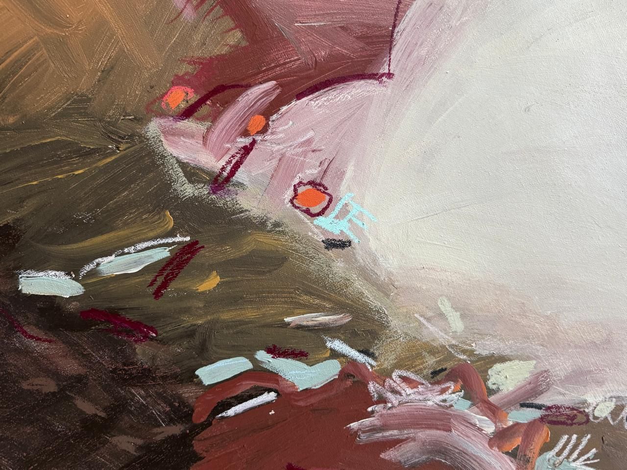 Abstract painting featuring strokes of brown, tan, and soft pink with small, scattered orange and blue highlights.