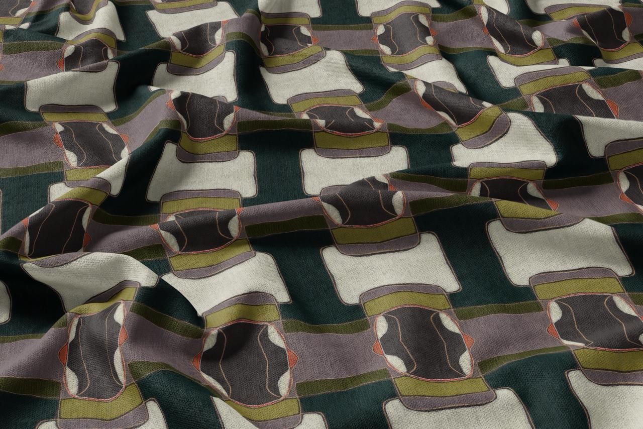 Close-up of folded camouflage fabric with green, brown, and gray geometric pattern