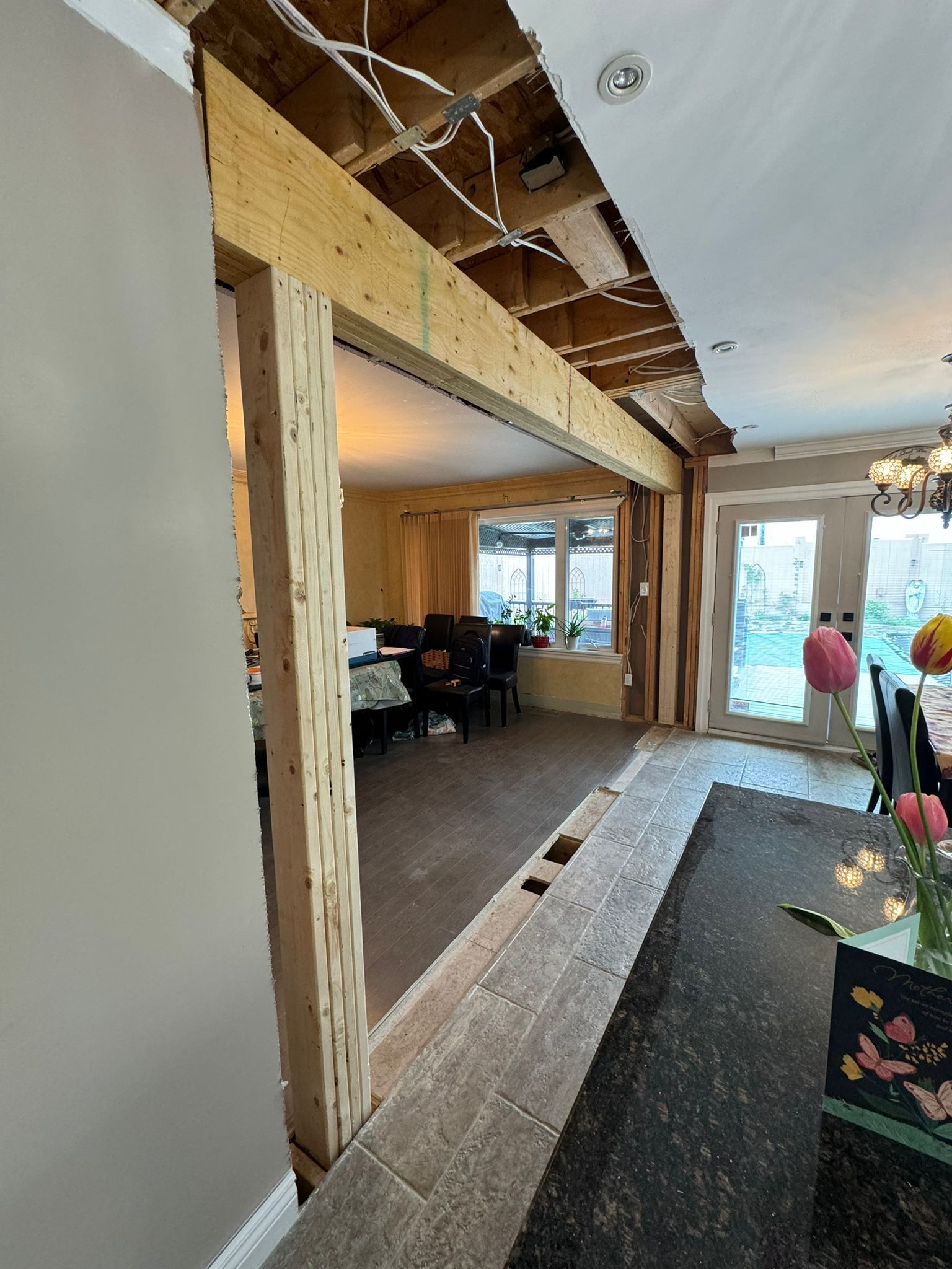 A living room and dining room are being remodeled in a house.