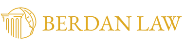 Gold logo for Berdan Law featuring a classic column integrated with a stylized leaf design.