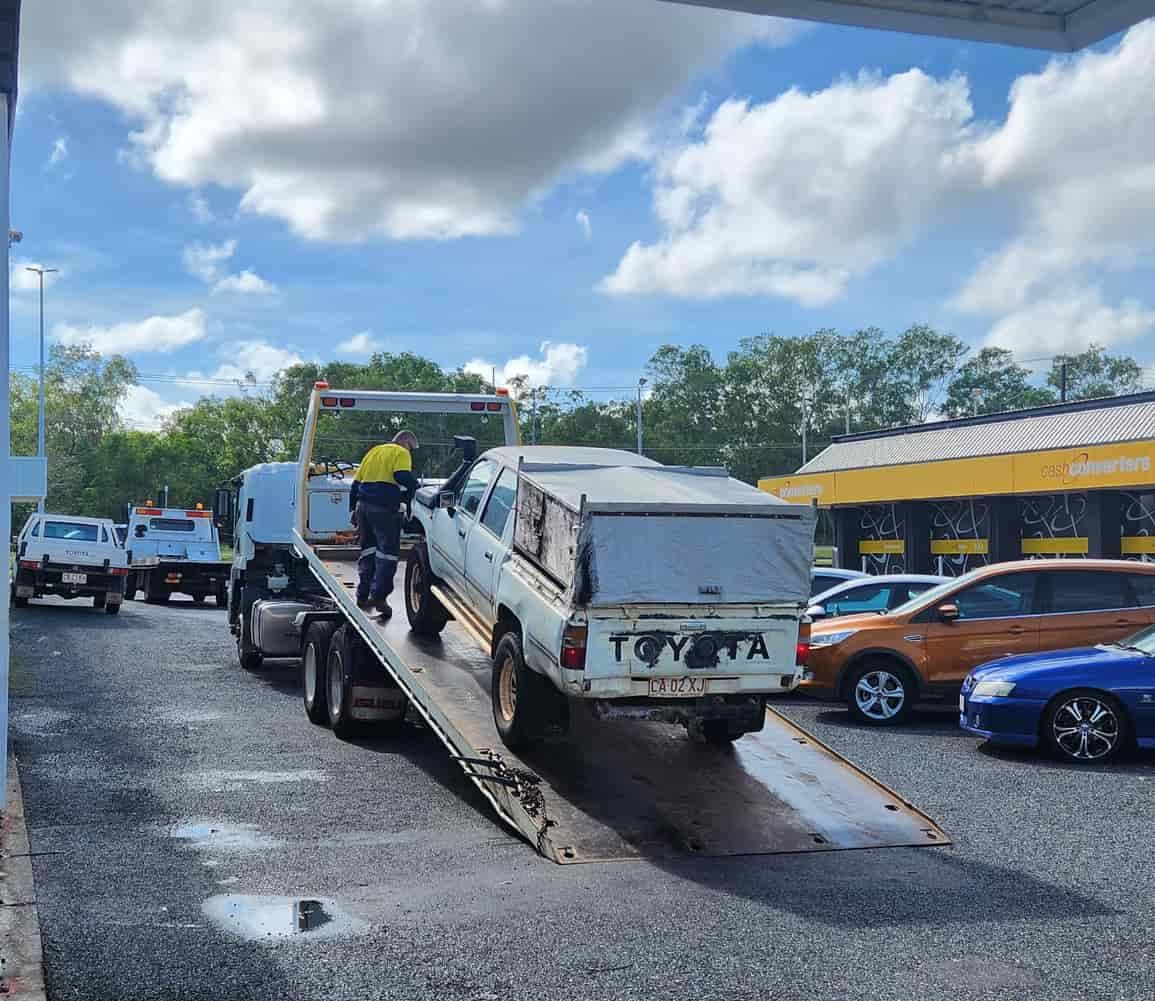 A Toyota Truck is Being Towed by a Tow Truck — JDM Mechanical & Aircon Repairs In Coconut Grove, NT