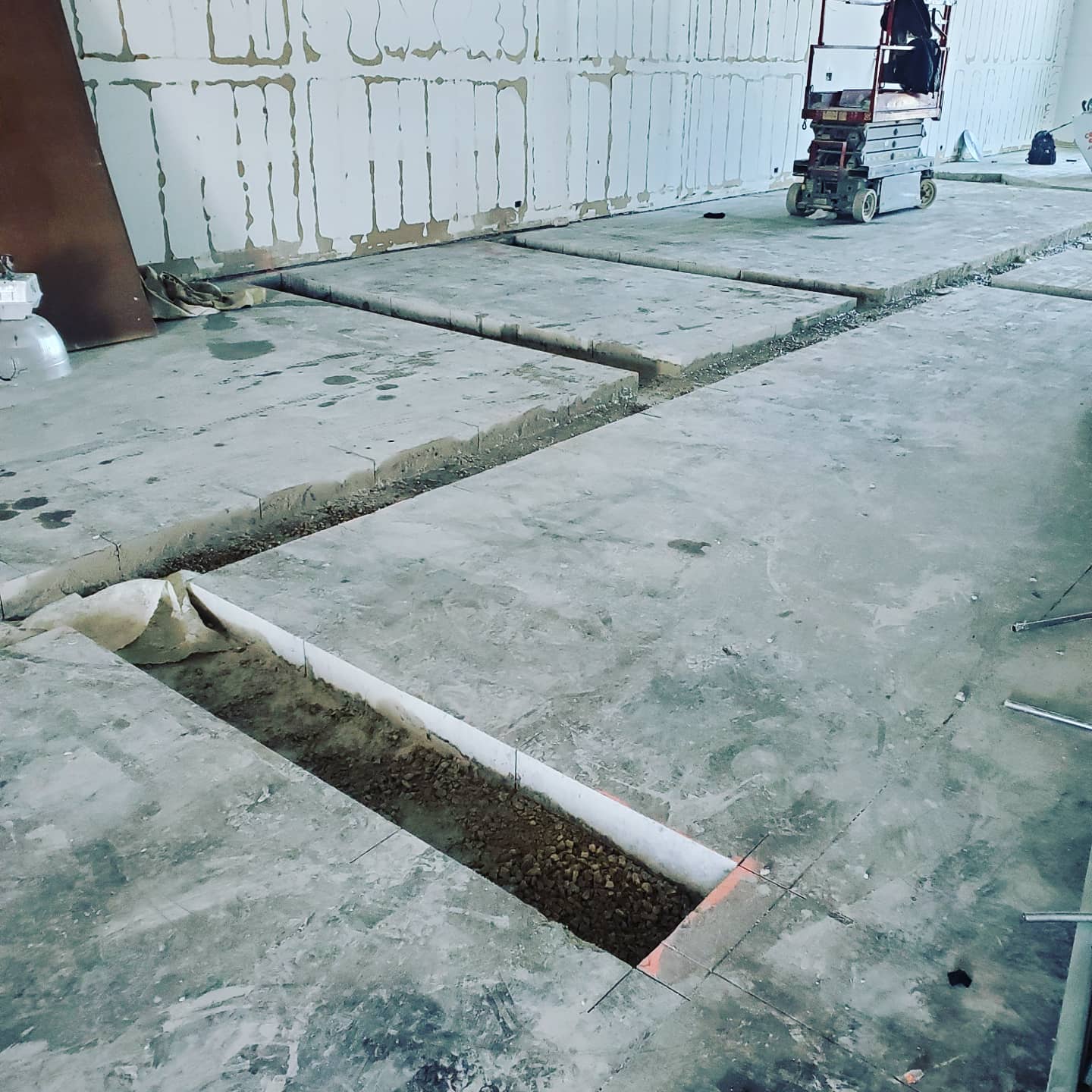 A concrete floor with a hole in the middle of it