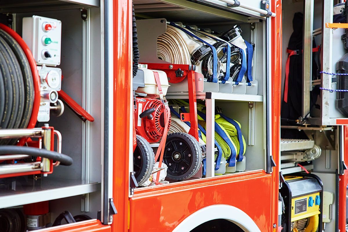 The inside of a red fire truck with the doors open