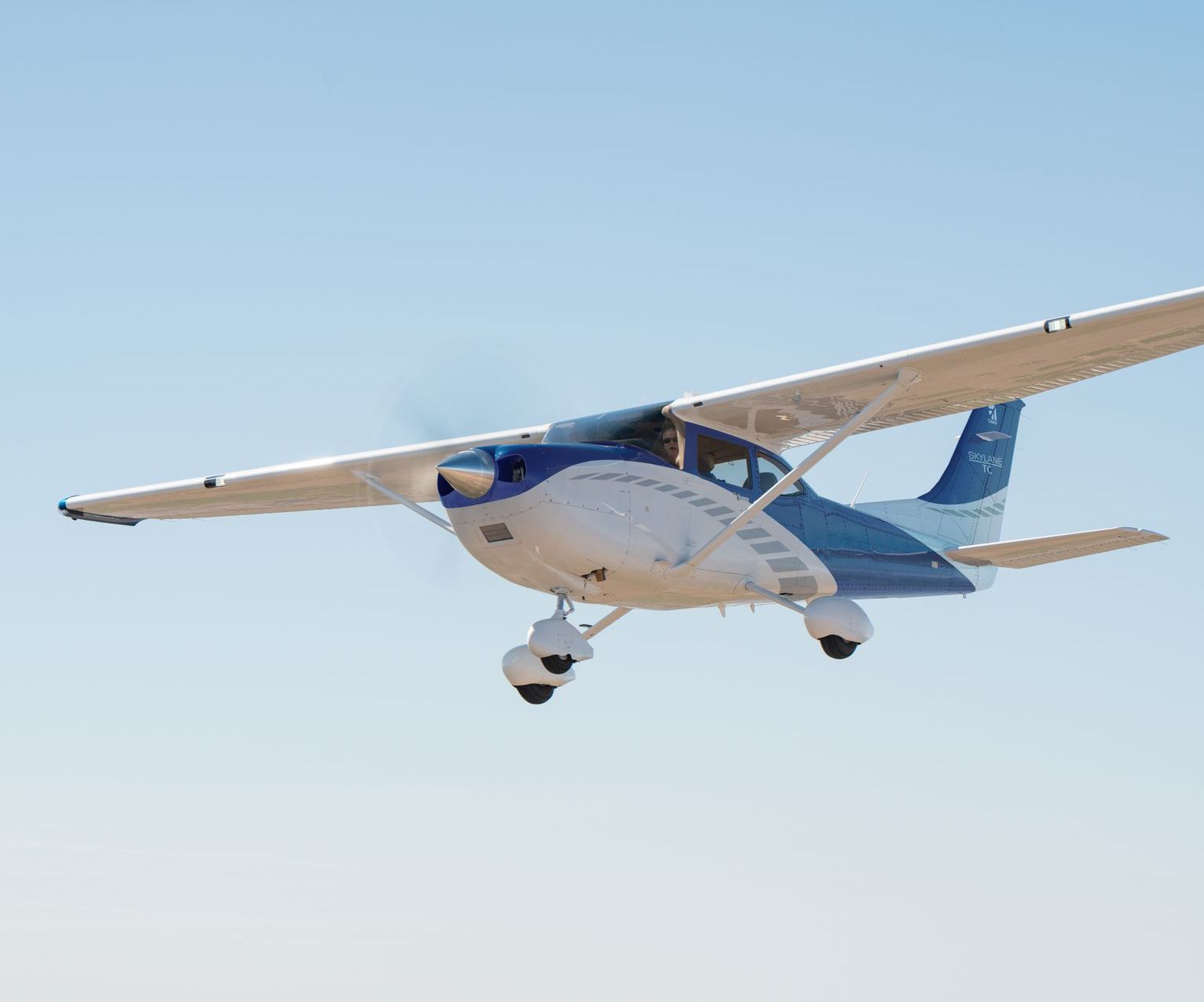 A Cessna small plane flying in the air