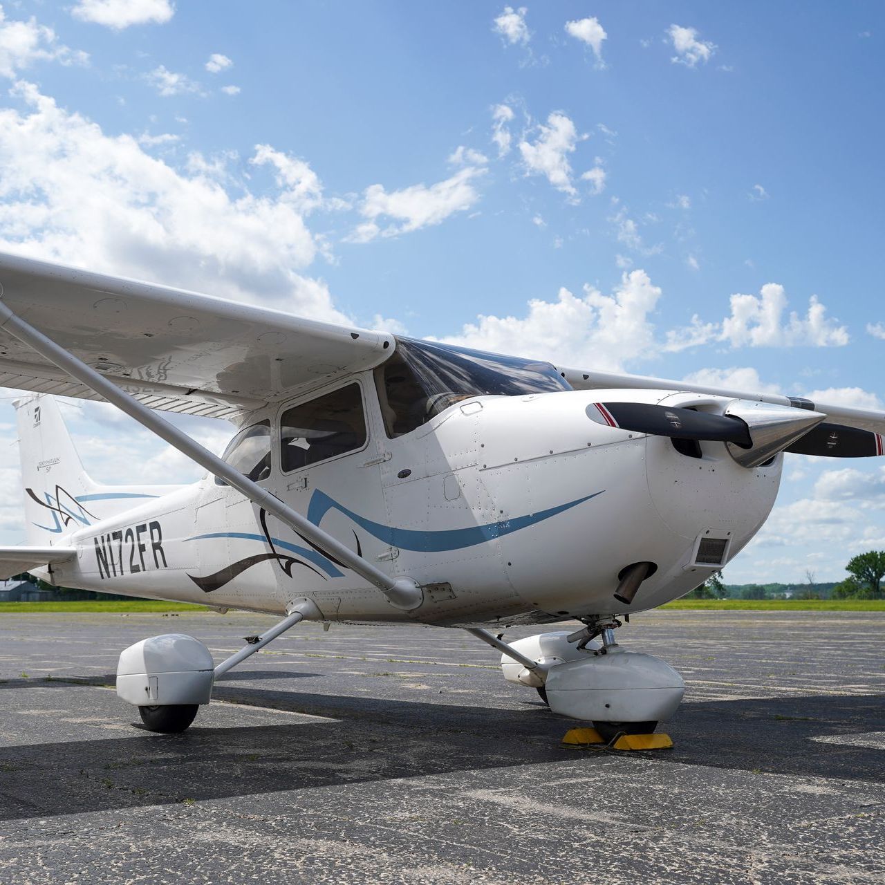 A private jet is parked inside of a hangar