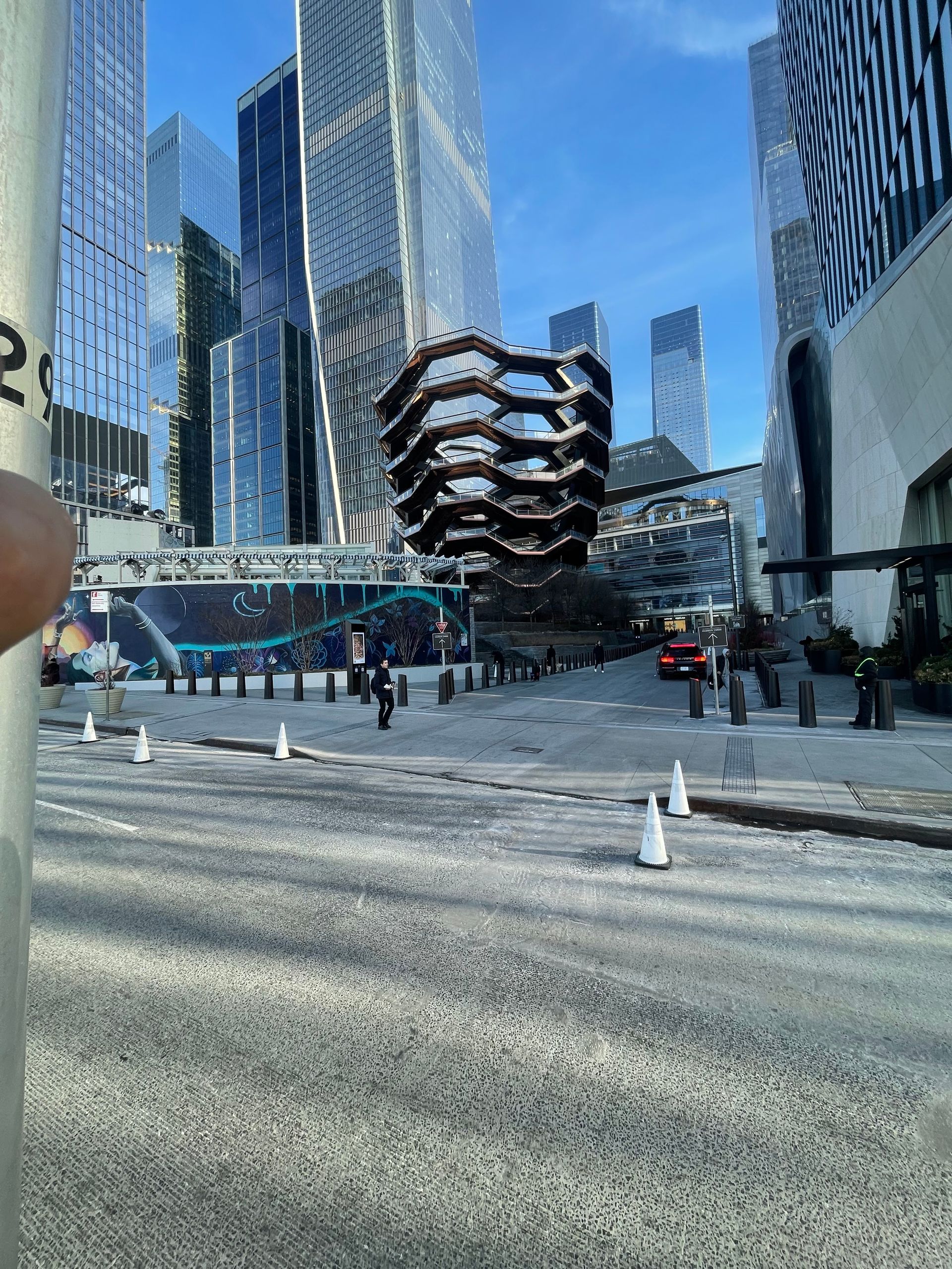 Exterior view of Hudson Yards plaza in New York City with the Vessel structure in background.