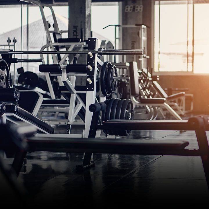 Strength training machines in a commercial fitness center.