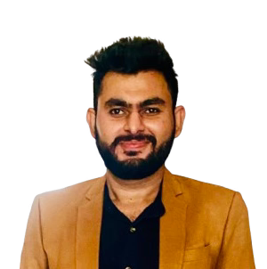 Man in a tan blazer and black shirt smiles, isolated on a white background.