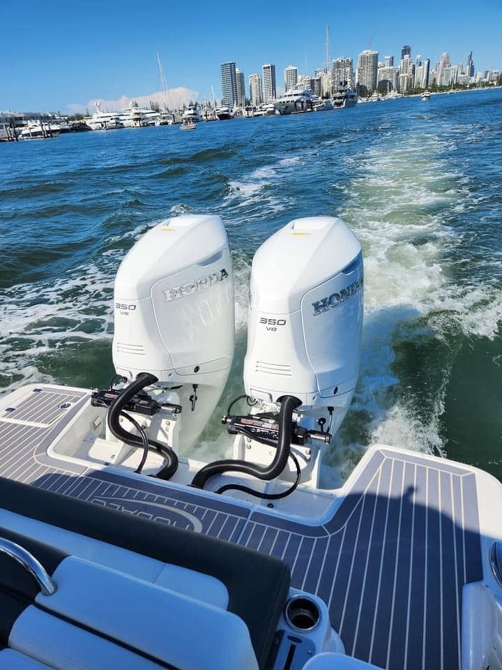 A Boat With Two Engines Is Floating On Top Of A Body Of Water — Cannonvale Marine In Jubilee Pocket, QLD
