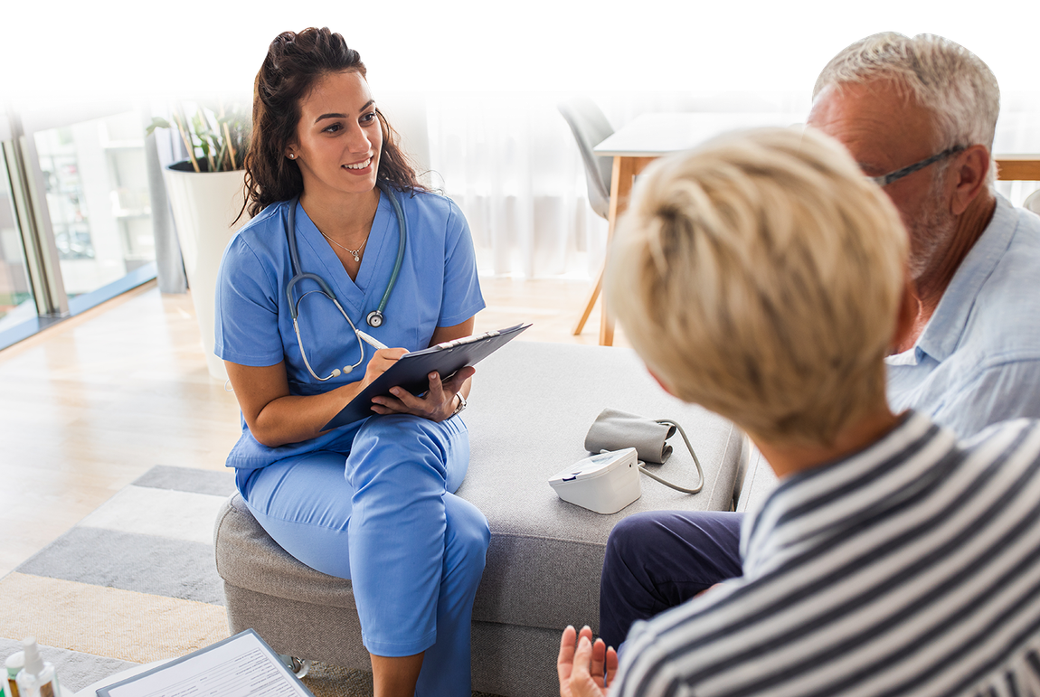 nurse assessing  elderly couple