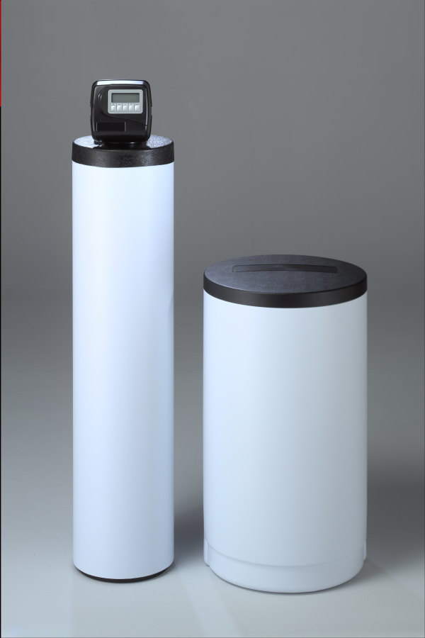 Two white cylinders with black lids are sitting next to each other on a table.