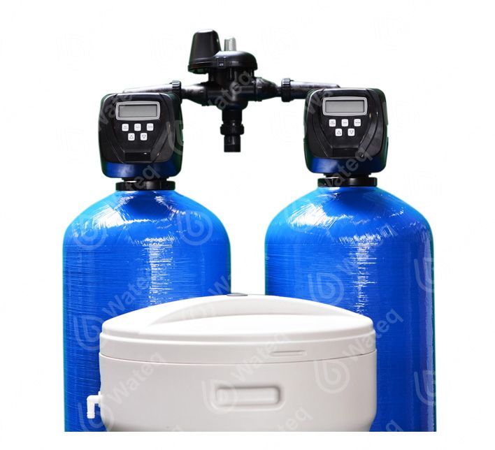Two blue water tanks with a white tank in the middle