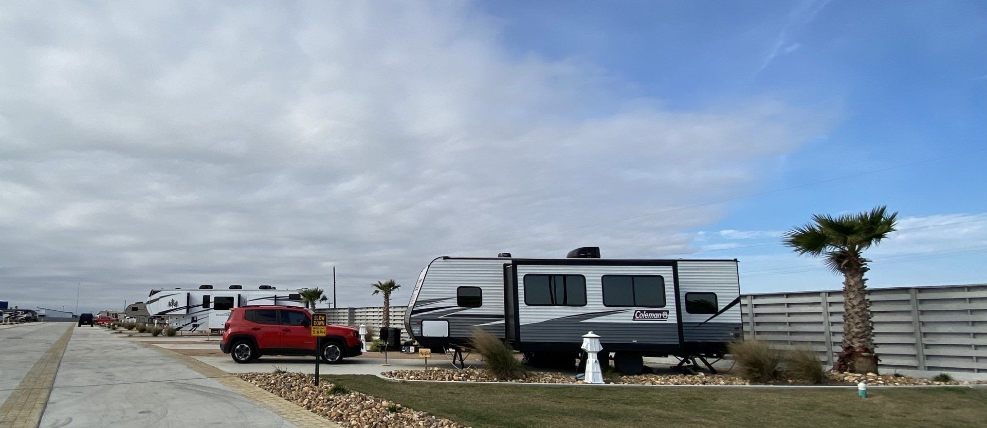 A row of rvs parked on the side of a road.