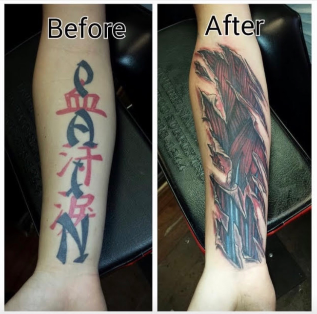 Tattoo artist working on a black-and-white arm tattoo in a studio