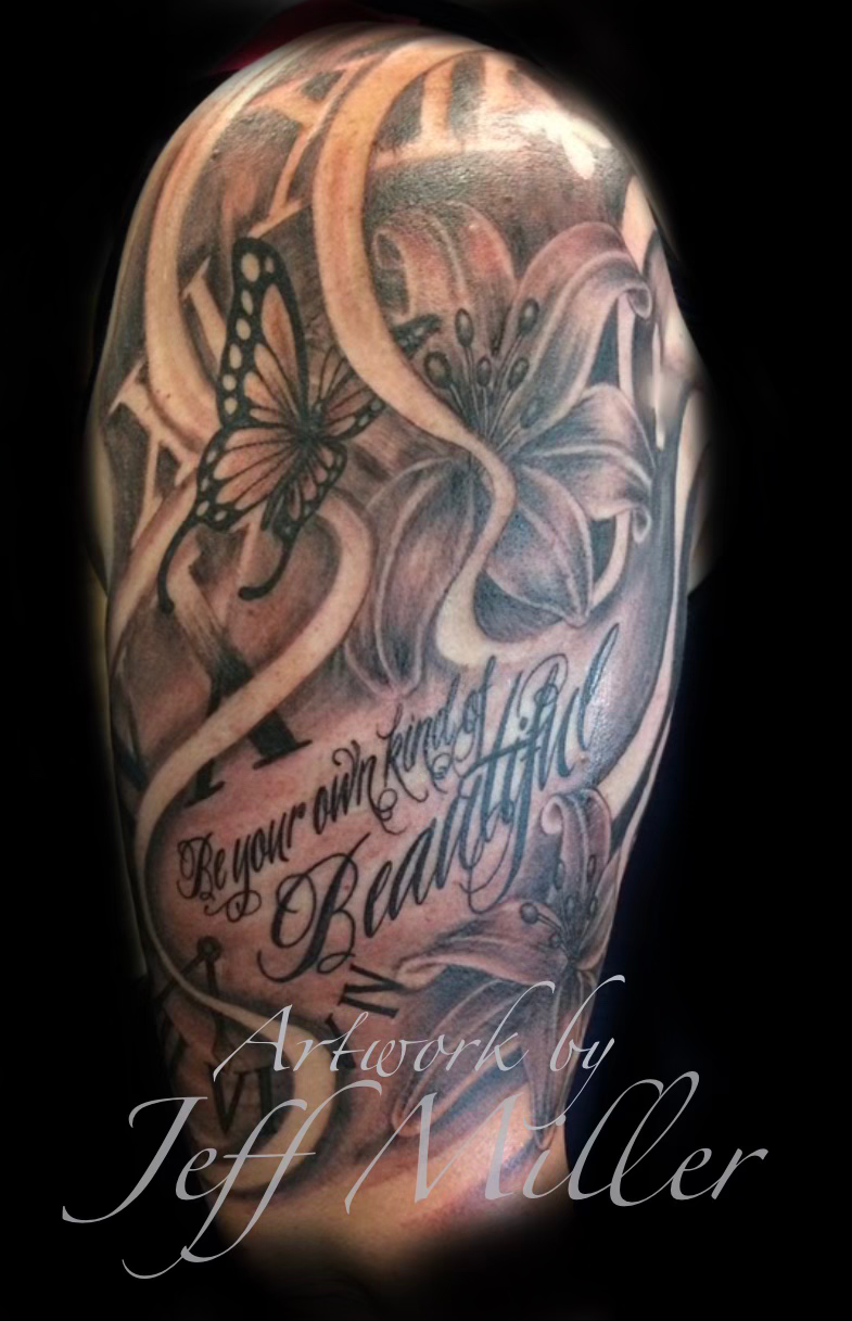 Tattooed forearm being inked with a tattoo machine by gloved artist in a dark studio
