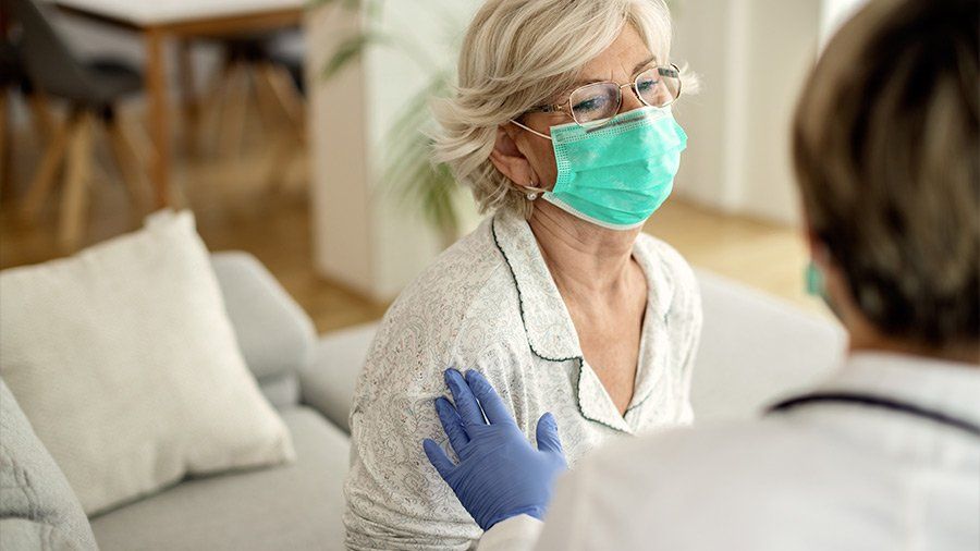 woman and doctor at house call
