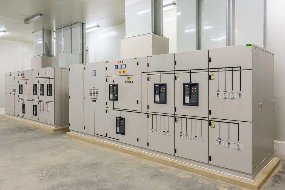 Electrical Panels in a Utility Room; Gray Cabinets With Meters — Darwin Electrical Services in Humpty Doo, NT