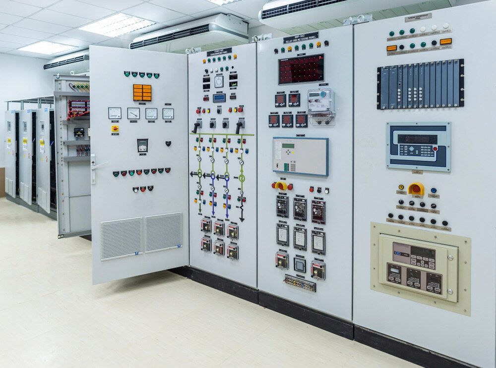 Panels in an Industrial Setting. White Cabinets With Various Gauges — Darwin Electrical Services in Rural & Remote, NT