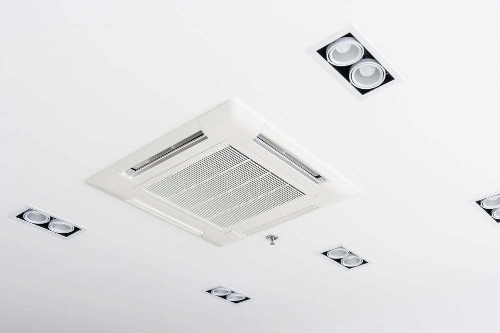 White Ceiling With a Square Air Conditioning Unit and Several Lights — Darwin Electrical Services in Rural & Remote, NT