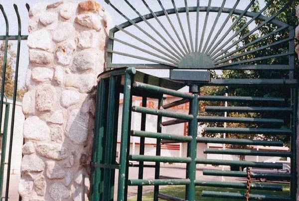 A wrought iron railing with a fancy design on it