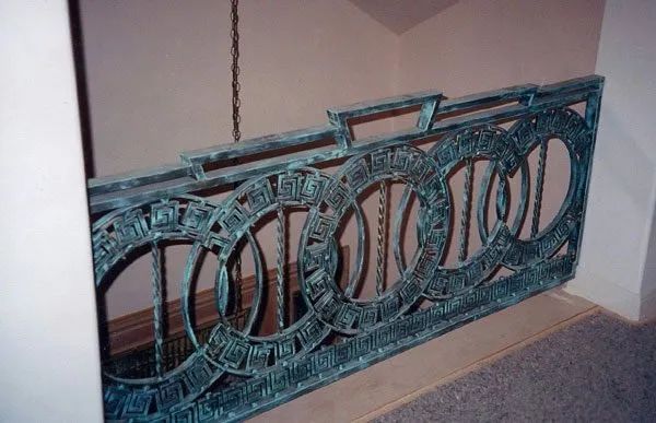 A green railing with the word toronto on it