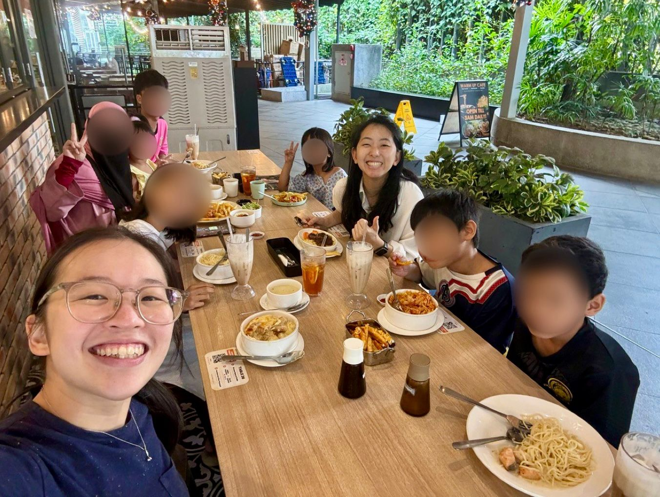 Befrienders Dawn and Rebcca enjoy a farewell meal with Auntie N’s family before they move out of the rental estate in 2024
