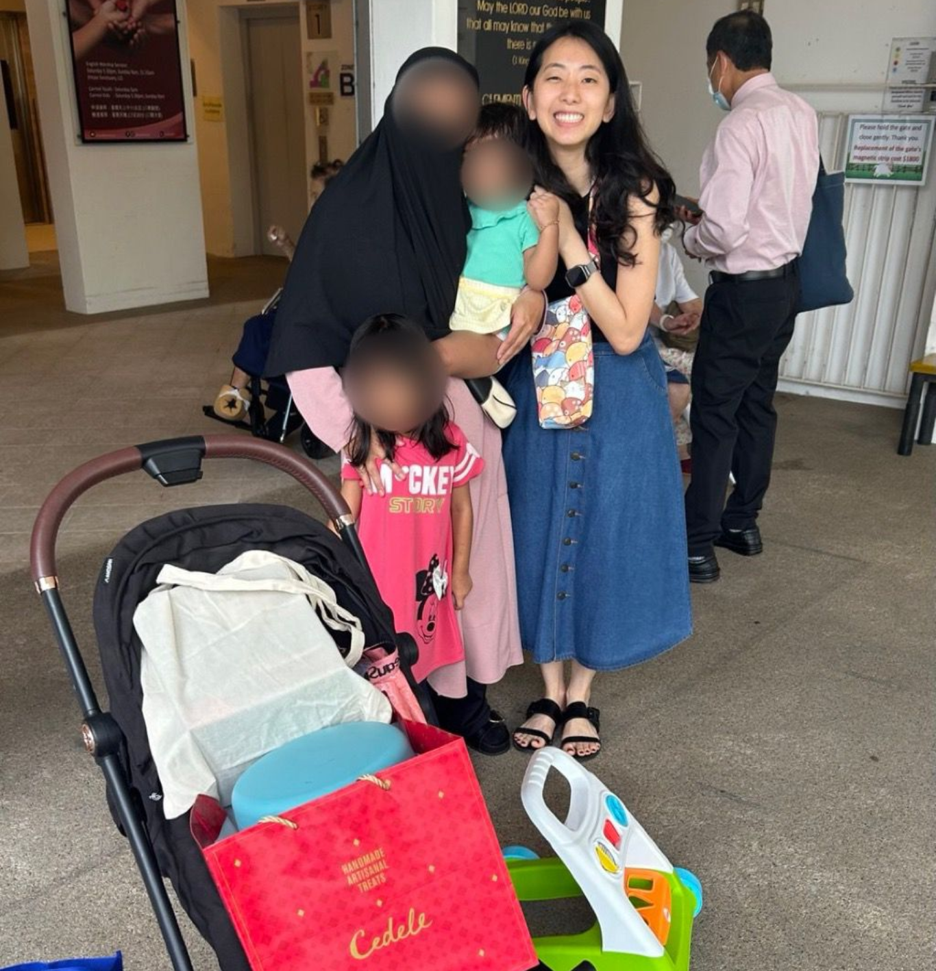 Photo of  Auntie N and her family visiting Mount Carmel’s Family Carnival and taking home many useful items at the pre-loved items fair