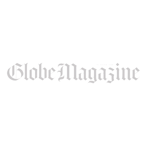 Globe Magazine logo, Gothic-style text, light gray on white background.