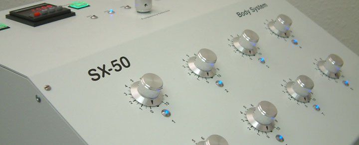 A white sx-50 control panel with a bunch of knobs on it