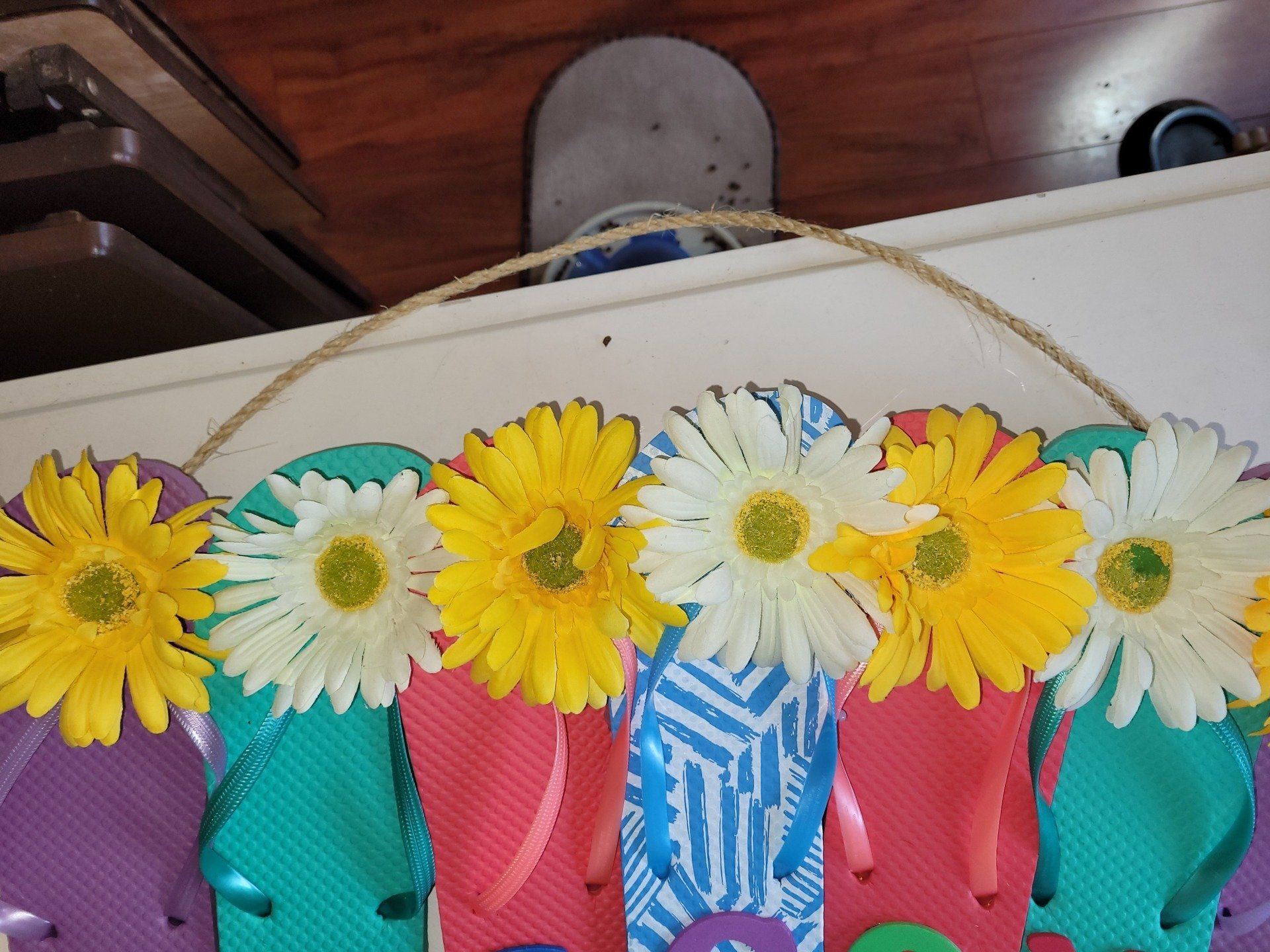 A bunch of flip flops with flowers on them