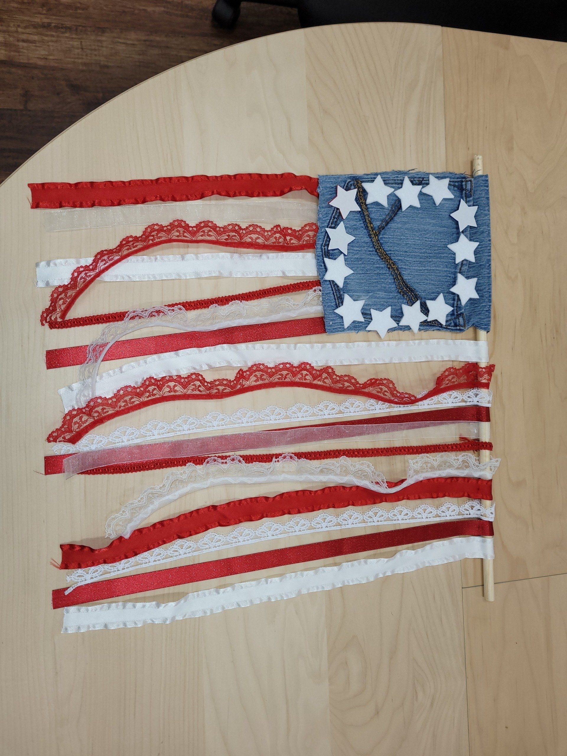 An american flag made out of red white and blue ribbons