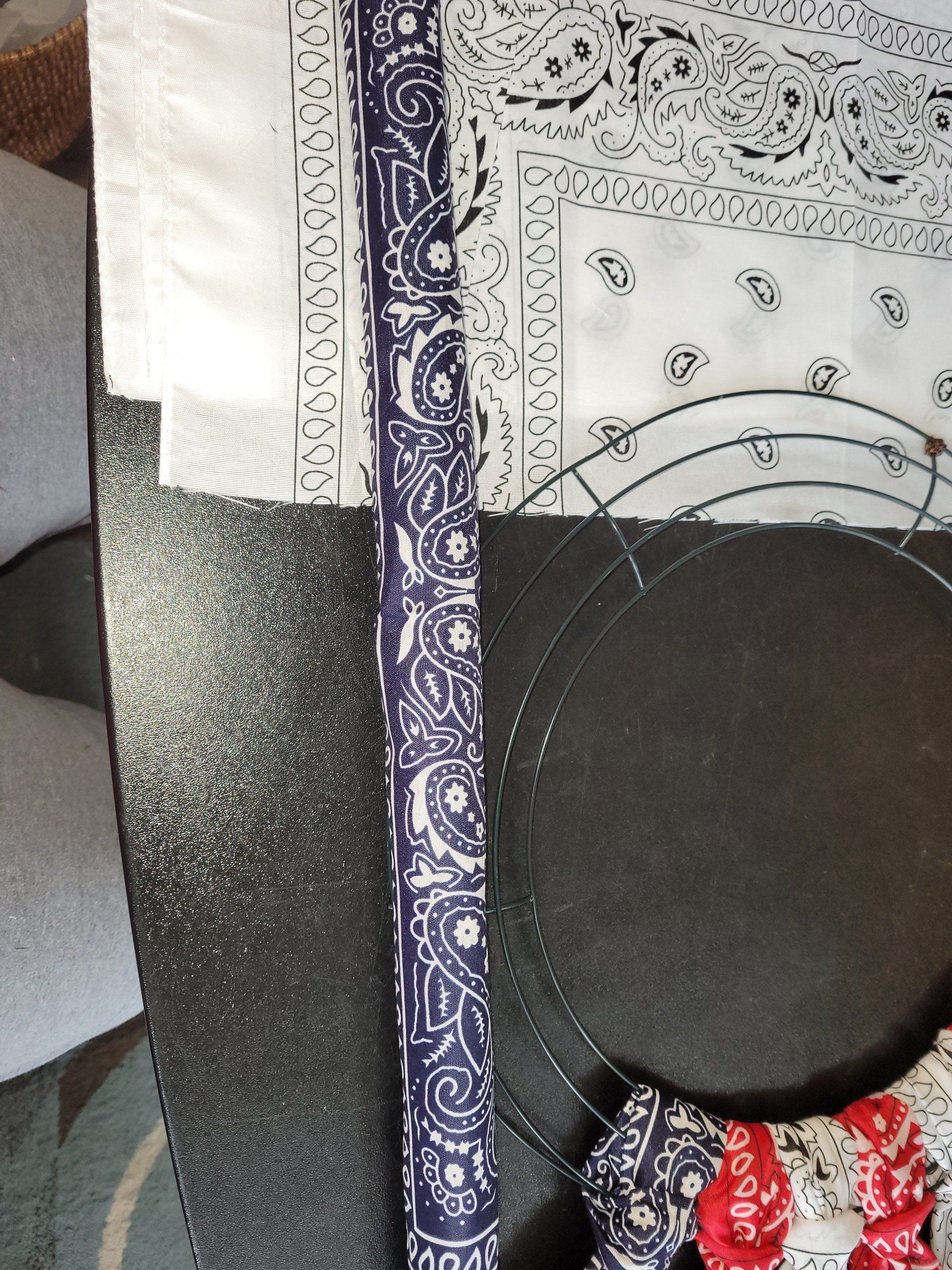 A blue and white bandana is laying on a table