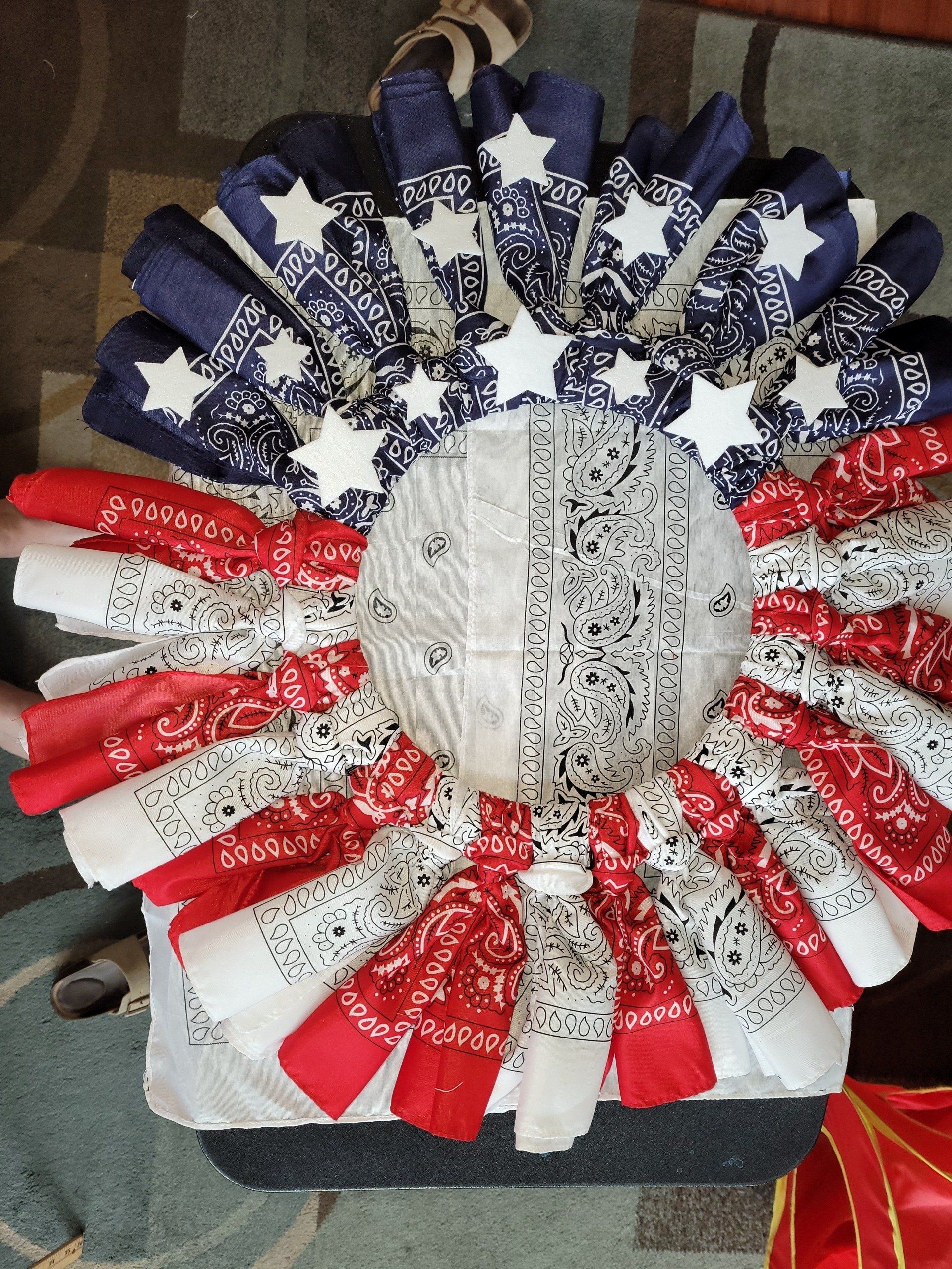 An american flag made out of bandanas and ribbons