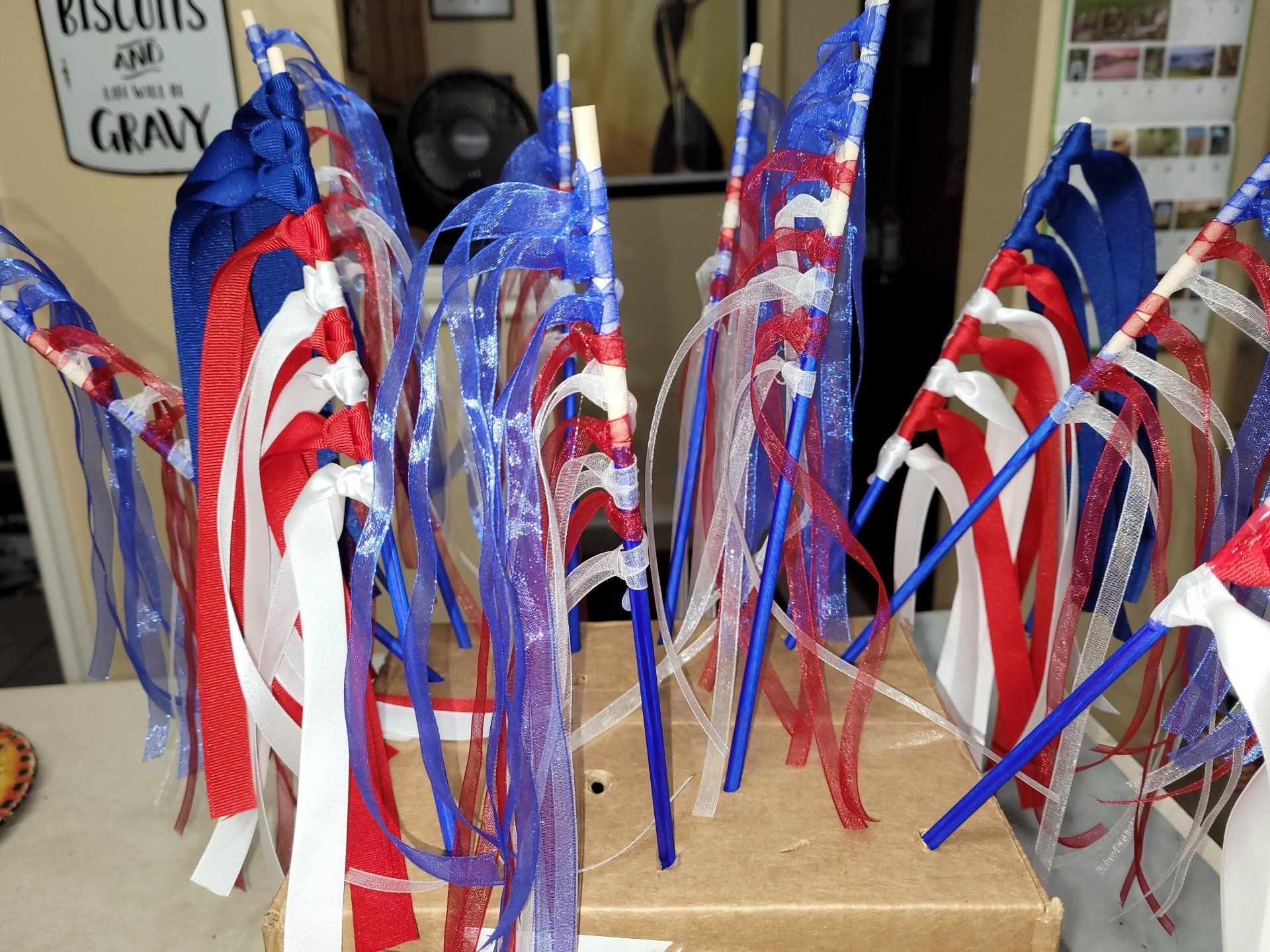 A bunch of red white and blue flags are sitting on a table