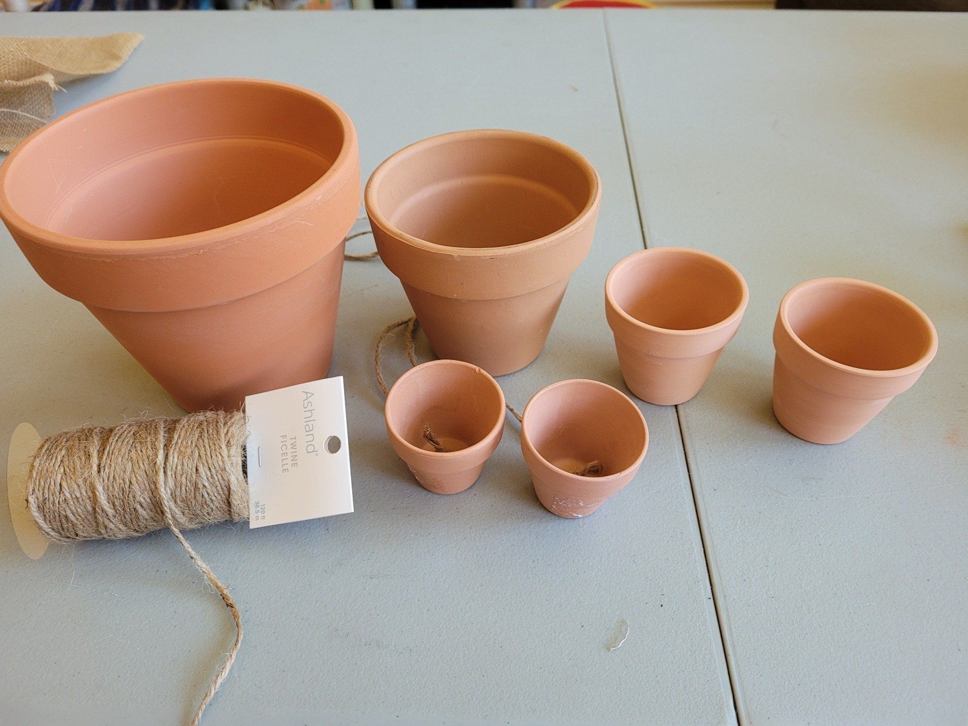 A bunch of clay pots are sitting on a table