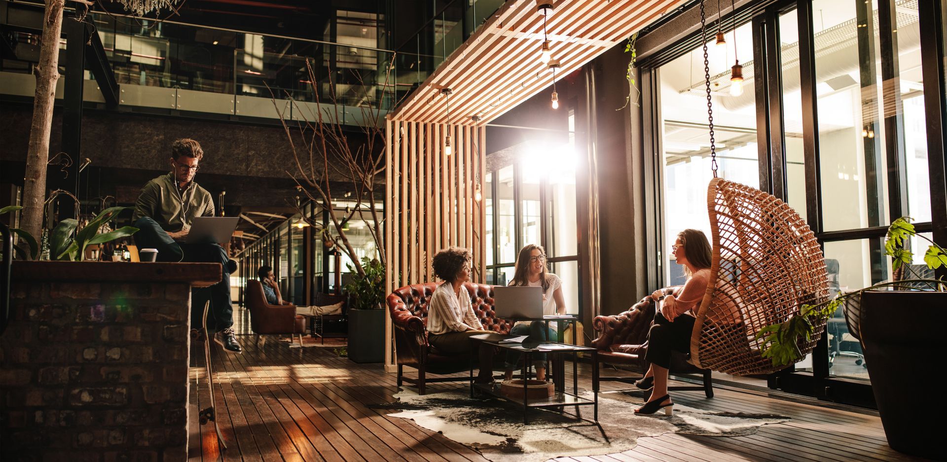 A group of people are sitting around a table in a room.