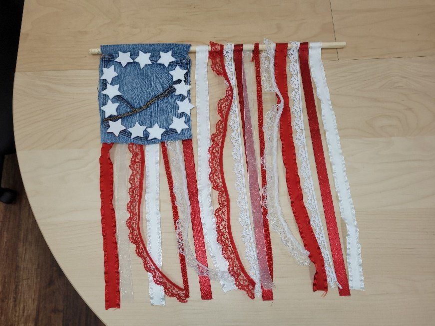 An american flag made out of red white and blue ribbons