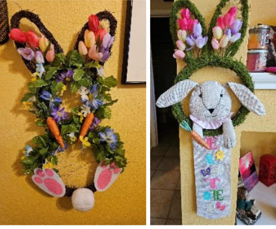 A bunny wreath with flowers and carrots is hanging on a wall
