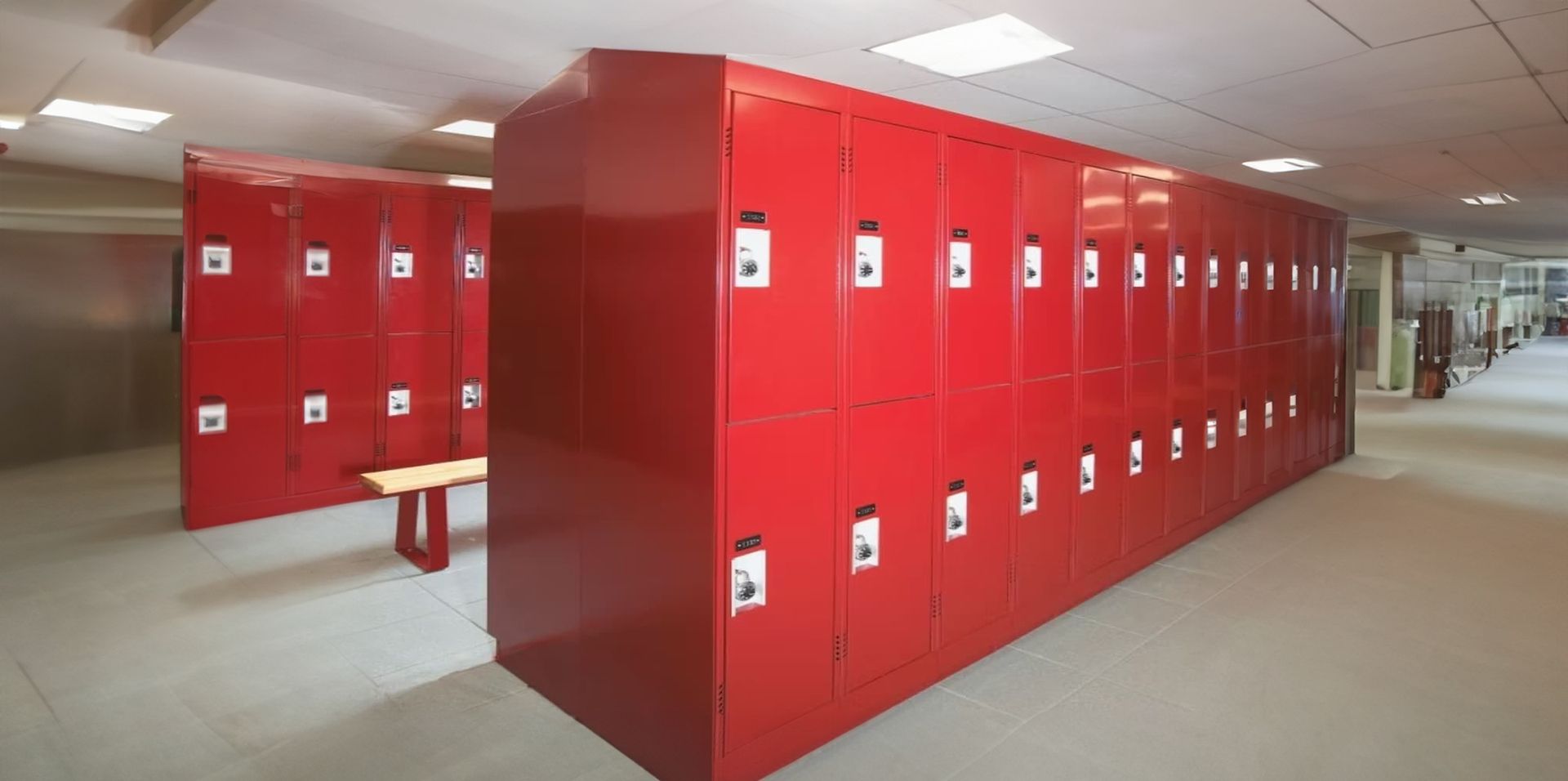 A row of red lockers in a locker room