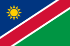 The national flag of Namibia: a diagonal red stripe bordered by white, with a blue top-left triangle and a golden sun.