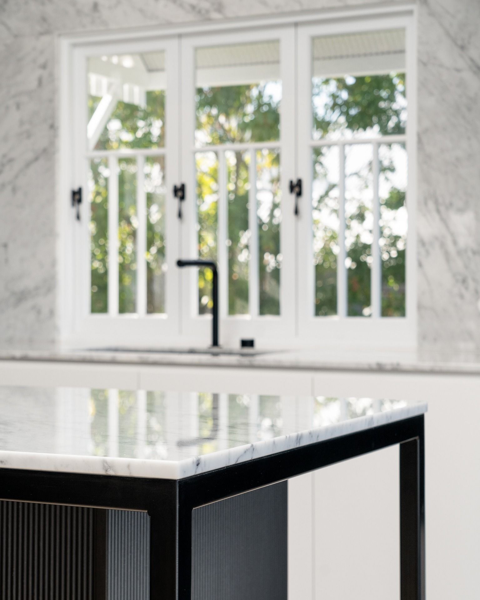 A Kitchen With a Sink and a Large Window — Hot Rock Granite In Tweed Heads, NSW