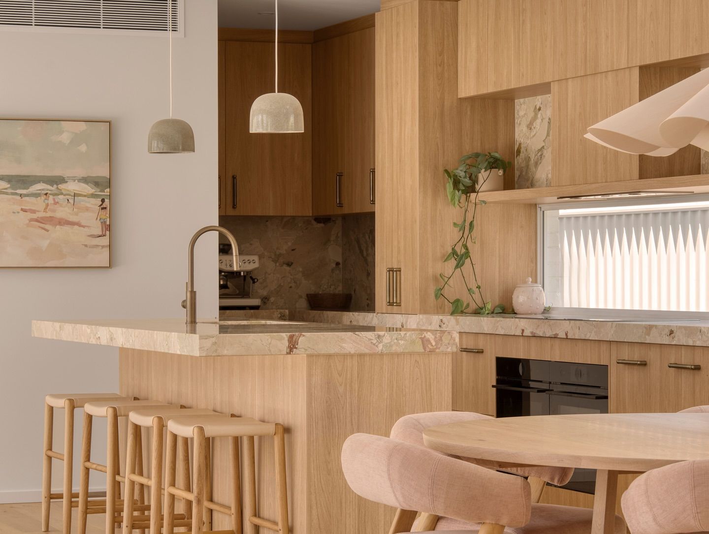 A Kitchen With Wooden Cabinets, a Table and Chairs — Hot Rock Granite In Burleigh Heads, QLD