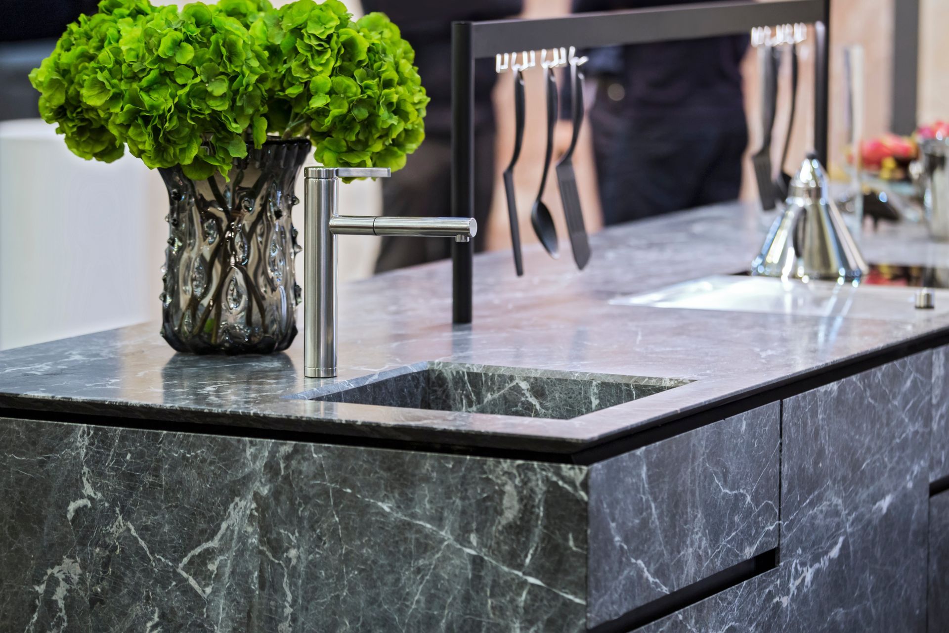 A Kitchen With Wooden Cabinets, a Sink, and Two Stools — Hot Rock Granite In Burleigh Heads, QLD