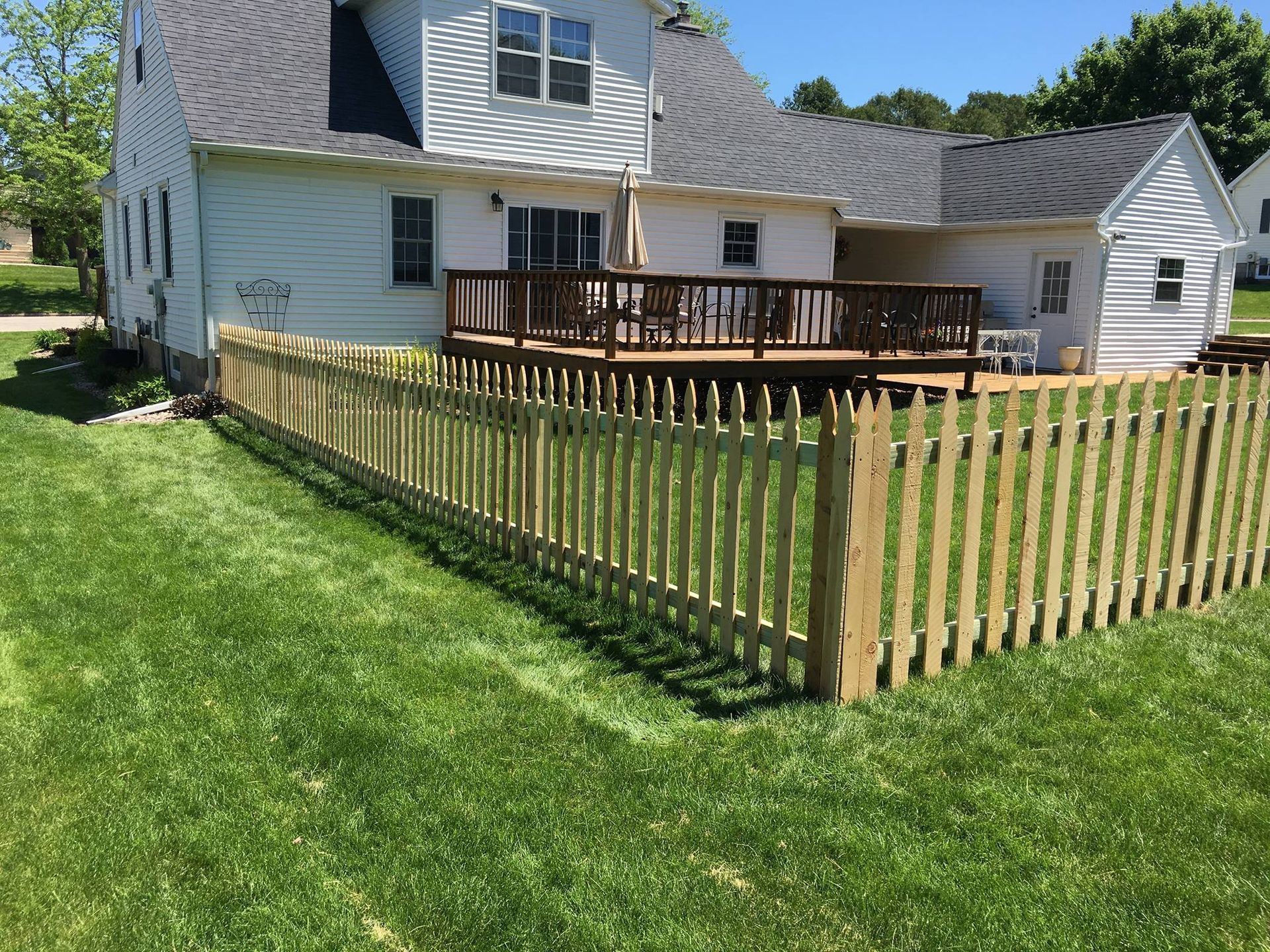 new wood fencing behind a home